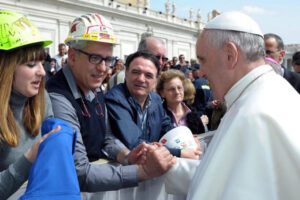 epa04151030 A handout photo provided by the Vatican media service 'Osservatore Romano' shows Pope Francis as he talks to Alcoa redundant workers from Sardinia at the end of his Wednesday's General Audience in Saint Peter's Square, in Vatican City, 02 April 2014. EPA/OSSERVATORE ROMANO/HANDOUT HANDOUT EDITORIAL USE ONLY/NO SALES